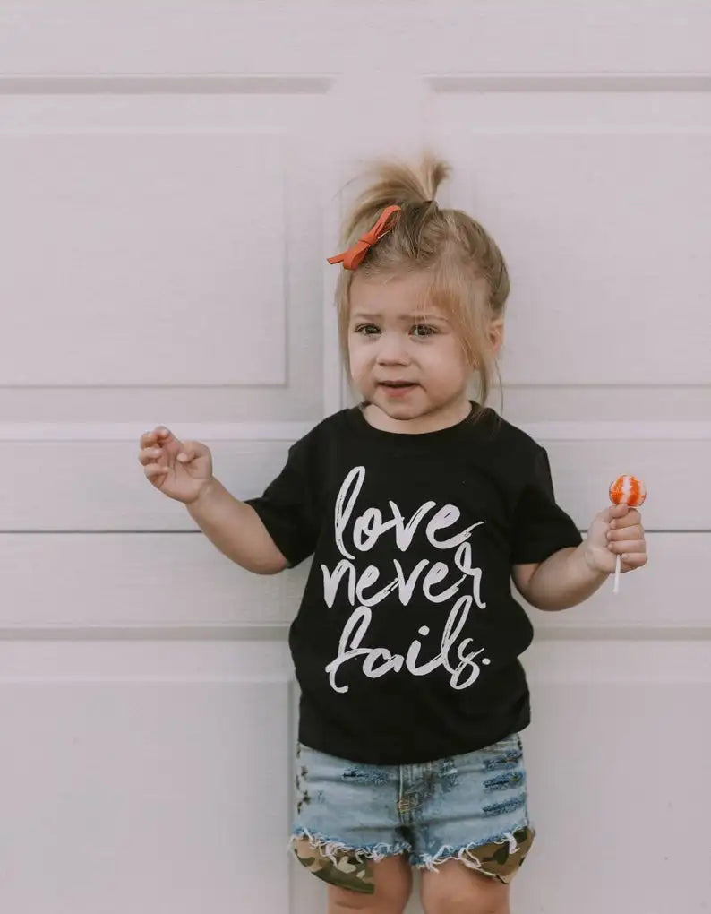 Love Never Fails Girls Heart Christian Shirt